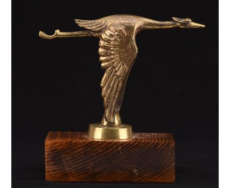 Vintage Flying Stork brass car mascot mounted on a oak base.  21cms tall. Please note this lot has the standard Ewbank's stan