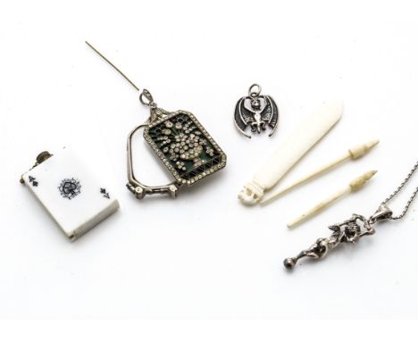 A pair of white metal and paste set art deco lorgnettes, the front piece decorated with flowering jardinière on paste set bal
