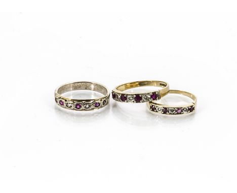 Two ruby and diamond gem set rings, in yellow metal, one paste example set in white metal (3) 