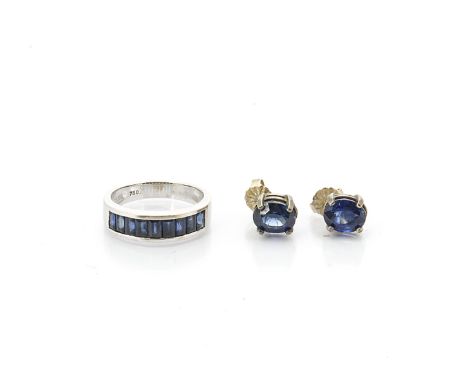 A contemporary 750 marked white metal channel set ring, set with step cut sapphires, ring size L, 4.2g together with a pair o