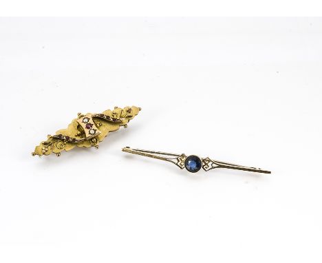 An Edward VII 9ct gold ruby and seed pearl bar brooch, dated Chester 1906, together with a 15ct gold blue paste and metal pin