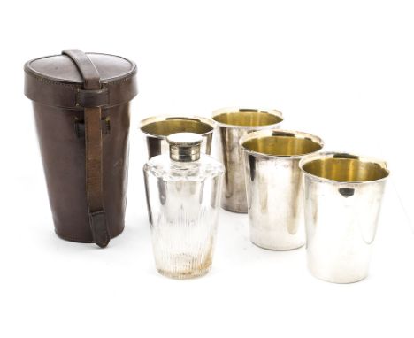 An Edwardian period travelling flask set by Rodgers Brothers, the leather holster containing four silver plated Beakers and a