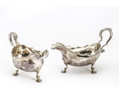 A pair of 1960s silver sauce boats by A C &amp; S Ltd, in the Georgian taste, on three pad shell feet, London 1965, 25 ozt (2
