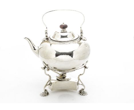 An Edwardian silver tea kettle on stand from Tessier, squat circular form with swing handle, two notable and other denting, o