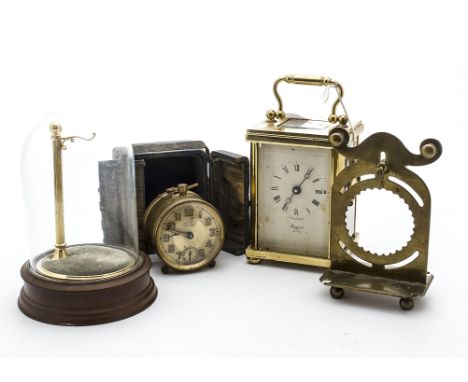 A modern Rapport brass carriage timepiece, together with an Art Deco travel clock, in tatty case, a brass trench art style po