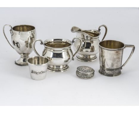 Six 20th Century white metal items, each marked sterling, including an ornate pill box, a milk jug and sugar basin, a small C