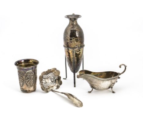 An early 20th Century American silver sauceboat by Theodore B. Starr, together with a Mexican silver vase in tripod stand, a 