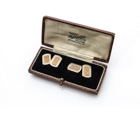 A cased pair of 9ct gold and enamel art deco cufflinks, the rectangular panels with engine turning to centre surrounded by wh