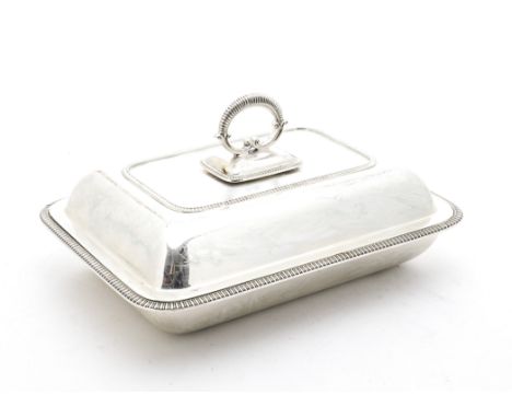 A George V silver serving dish and cover, the rectangular entrée dish having feathered rim and lid with detachable handle, Sh