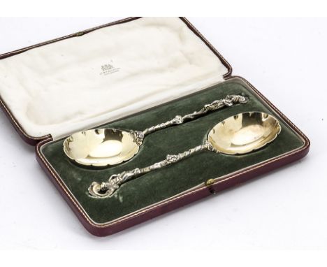 A pair of cased Edwardian silver spoons by Elkington & Co, the ornate serving spoons in red and gilt leather Elkington & Co f