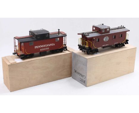 Two-scratch built G scale caboose’s, each on two 4-wheel bogies, white lettering: Pennsylvania 489056, oxide colour, metal bo