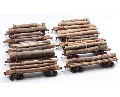 Ten scratch-built G scale, lumber wagons, each on two 4-wheel bogies and each loaded with genuine wood timber. (E) in a plast