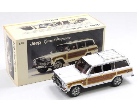 An Autoart Millennium 1/18 scale boxed diecast model of a Jeep Grand Wagoneer, 1989 example, finished in white, model No. 740
