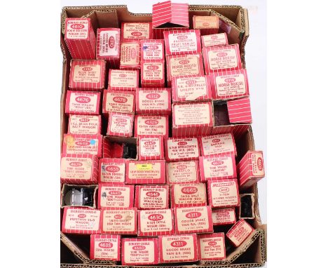 Small supermarket tray full of Hornby-Dublo plastic wheeled goods wagons in red/white striped boxes, including hopper, UD tan