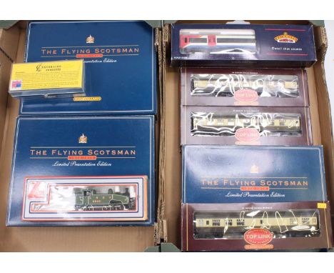 Two trays containing a collection of mixed 00 scale boxed Hornby, Bachmann, Lima and similar items of rolling stock and track