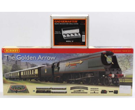 A Hornby Railways No. R1119 The Golden Arrow boxed train set (DCC ready) together with a model Q Gaugemaster ControllerThe se