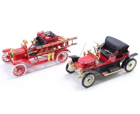 A Franklin Mint boxed diecast group to include a Ford Model T fire engine and an as found Stanley Steamer vintage car
