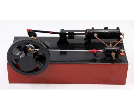 Scratchbuilt stationary horizontal mill engine, comprising of a single cylinder engine with slip eccentric, with cast in exha