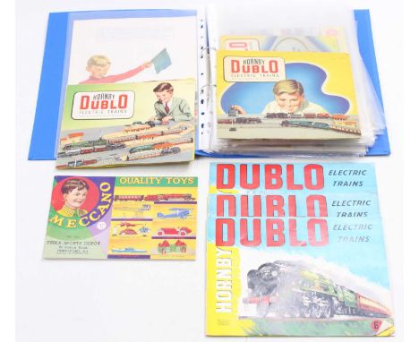 A ring-binder containing approx. 19 Hornby-Dublo catalogues (all post-war except one repro pre-war), some instruction leaflet