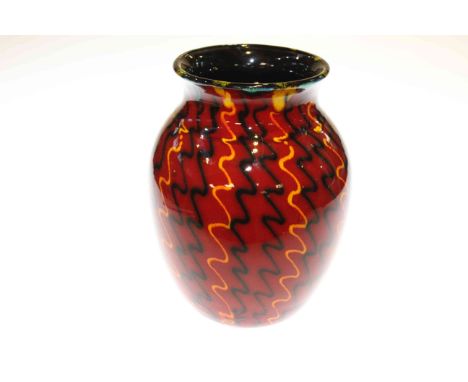 Poole Pottery vase with geometric design on red ground