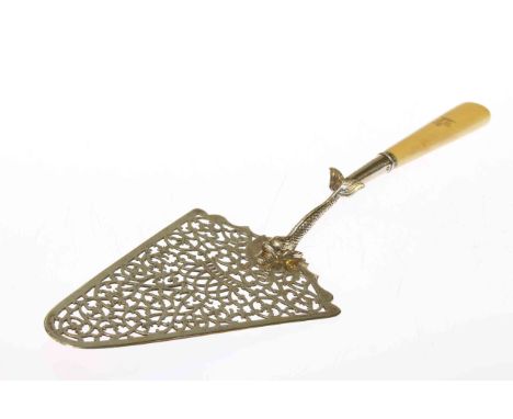 George III silver fish server in the form of a trowel, London 1773, with crested ivory handle, 34cm