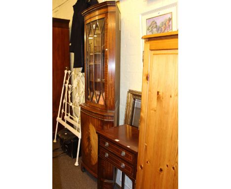 Mahogany bow front double corner cabinet, two drawer side table, tripod plant stand, gilt framed mirror and four floral pictu