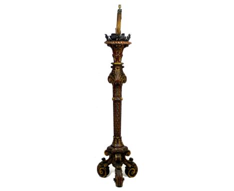 An early 20th century Italian style torchere standard lamp, decorated with gilt and polychrome foliate scrolls, raised upon t