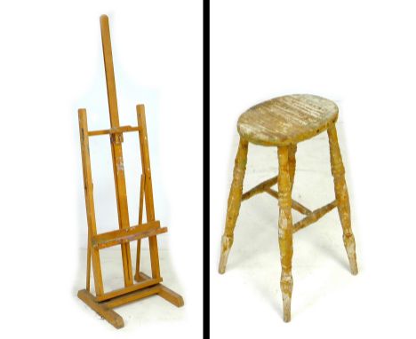 Doreen Kern's wooden easel, 51.5 by 48 by 184.5cm high, together with a stool from her studio, covered with wax and other mat