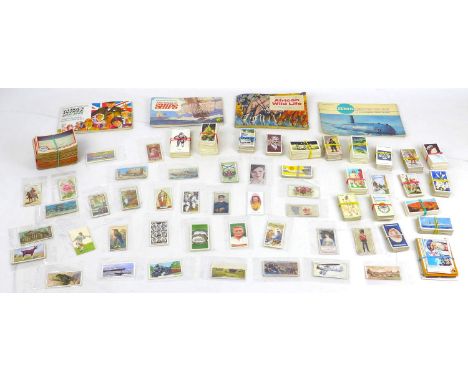 A large collection of cigarette cards and matchboxes and other ephemera, including an array of loose sporting, military, hist
