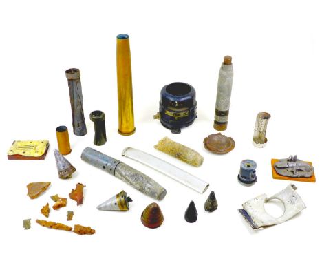 A collection WWII aircraft relics and inert shells, including an aeronautical compass, a shell case for a Bofors artillery gu