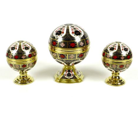 A set of three Royal Crown Derby paperweights, comprising 'Millenium Globe Clock', 'Millenium Globe Thermometer', and 'Millen