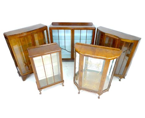 A group of five vintage glazed display cabinets, 1940's to 1960's, most with glass shelves, 60 by 29.5 by 107cm high, 119 by 