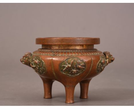 C18th Chinese gilt-bronze tripod censer, the globular body with two Buddhist lion mask handles, each section decorated with a