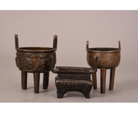 Chinese bronze tripod censer, Ding, cast with twin upright handles and decorated with taotie motifs, 10.6cm high; together wi