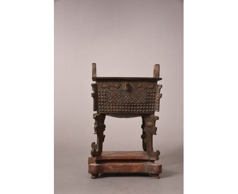 Chinese bronze archaistic censer 'Fangding', raised on four dragon supports with two upright loop handles, the body cast with