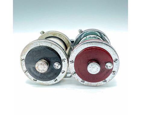 Lot of two great Penn Squidder #140 reels, with steel gears, chrome on brass, and Bakelite spools. Depiction of Fisherman wit