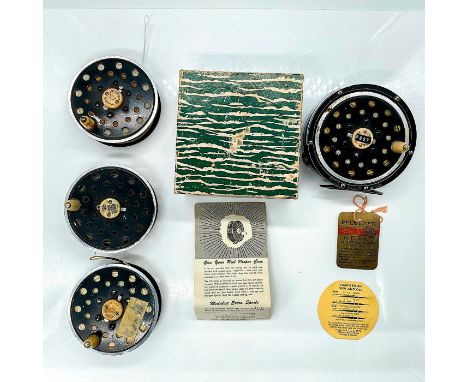 Pflueger fly reel with box and original papers, measures 4.5"L x 4.5"W x 3"H. Three extra spools with measurements 3.5"L x 3.