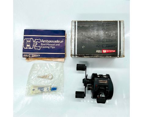 Left hand model Ambassadeur 521 XLT Plus LH. This item has its original papers and box which measures 3.75"L x 2.75"W x 5.5"H