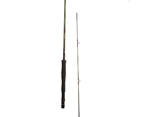 Beautiful fly rod with a light, slow tip, casts smoothly, built on dark green blank with gold tipped plum colored wraps. Mode