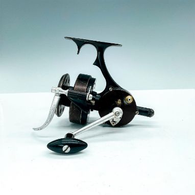Early and rare spinning reel made in France with black painted metal, trigger grip, and stamped Centaure Pacific. Very unique