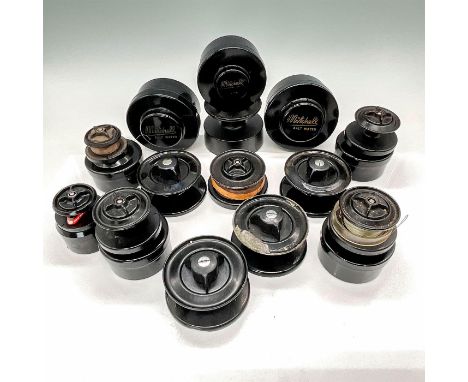 Group of different sized spools for vintage Mitchell reels including 300, 302, 306, and 308, with some original plastic cases