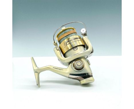 Shiny gold spinning reel marked Pflueger, Issued: 20th CenturyDimensions: 5.25"L x 4.5"W 5.5"HCountry of Origin: USAManufactu