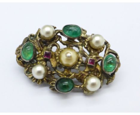 An Austro Hungarian silver gilt, ruby, emerald and pearl brooch, 3cm