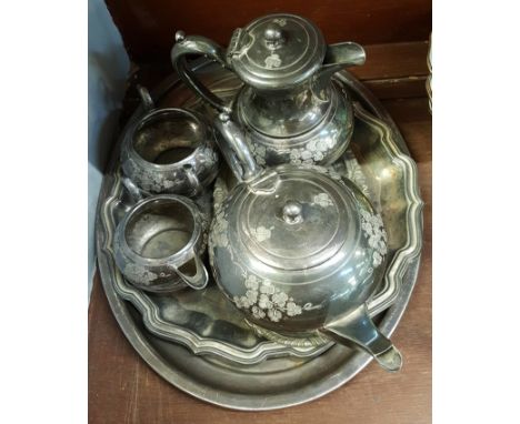 A four piece silver plated tea service and three trays