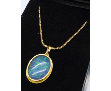 A doublet opal set pendant and plated chain