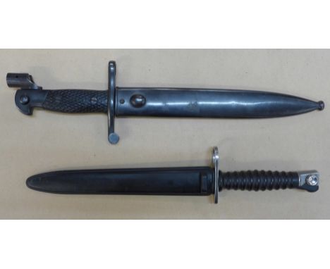 A Spanish bayonet and metal scabbard and a Swiss bayonet and metal scabbard