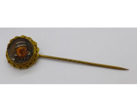A fox head stick pin in associated case