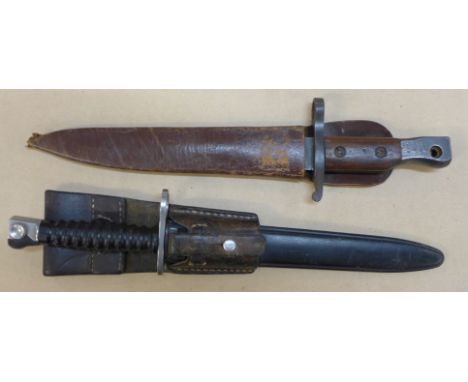 A Canadian Ross bayonet and scabbard and a Swiss bayonet and scabbard