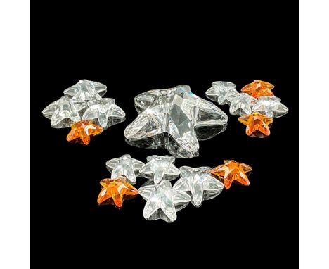 This stunning starfish is surrounded by 15 mini starfish in clear and light amber crystal. Original boxes included with large