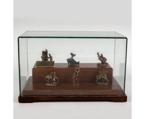 Includes 6 tiny brass figurines depicting early American life. Each piece has Goebel Olszewski backstamp. This item has a bas